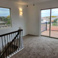 Spare room with light colored carpet