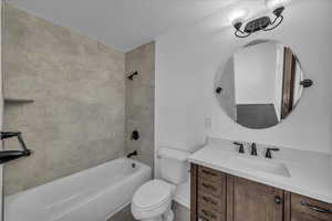 Full bath featuring shower / tub combination and vanity