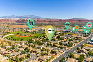 Aerial view of residential area featuring a mountainous background