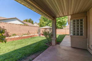 Fenced backyard featuring a patio area