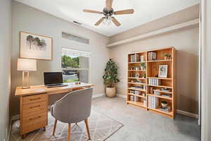 Office with baseboards and ceiling fan