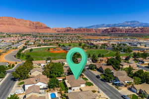 View of property location featuring nearby suburban area and a mountainous background