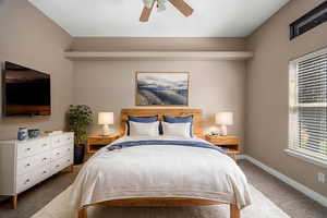 Bedroom with carpet flooring and a ceiling fan