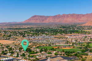 Aerial perspective of suburban area with a mountain backdrop