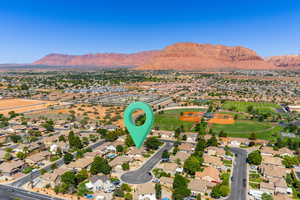 View of property location with nearby suburban area and mountains