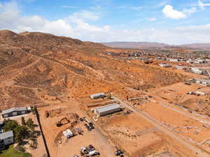 View of property location featuring mountains and a desert landscape