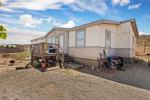 Manufactured / mobile home with a wooden deck
