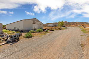 View of street featuring an outbuilding and a mountain view