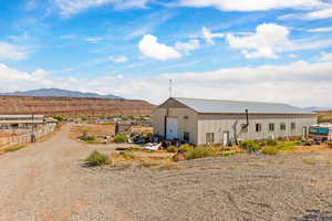 View of pole building with a mountain view