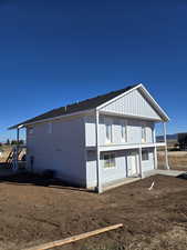 View of side of property featuring board and batten siding and a central air condition unit