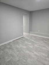 Room featuring baseboards