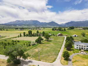 Aerial view of sparsely populated area featuring a mountainous background
