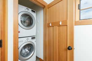 Laundry room featuring estacked washer and dryer