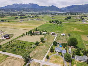 Overview of rural landscape featuring a mountainous background