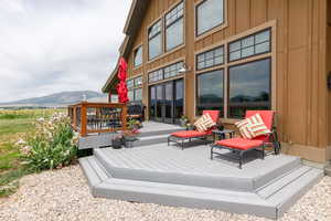 Wooden terrace with a mountain view and french doors
