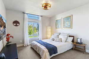 Carpeted bedroom with baseboards