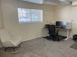 Office area with carpet flooring