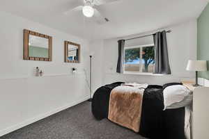 Bedroom featuring carpet and a ceiling fan