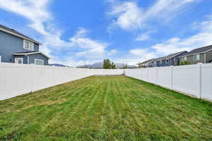 View of fenced backyard