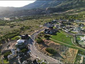 Aerial view of property's location featuring mountains