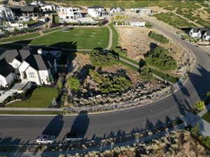 Aerial view of property's location featuring nearby suburban area