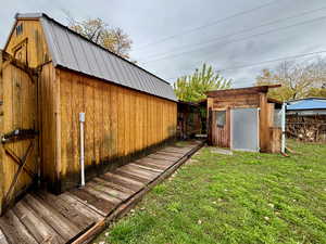 View of yard with a storage shed