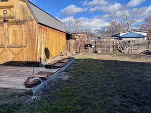 Fenced yard with a storage unit