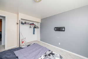 Bedroom with carpet and a closet