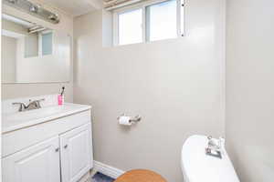 Bathroom featuring toilet and vanity