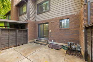 View of fenced patio featuring a gate