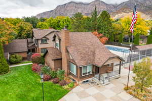 View of community clubhouse and in-ground pool