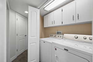 Laundry area featuring cabinet storage