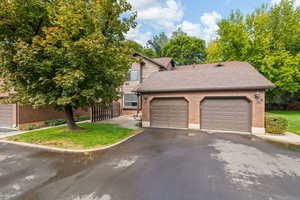 View of property exterior showing subject garage and attached neighboring garage