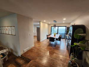 Dining room featuring wood finished floors and recessed lighting