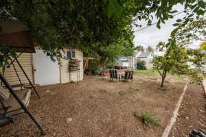 View of yard featuring an outdoor structure