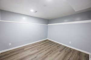Unfurnished room featuring wood finished floors and baseboards