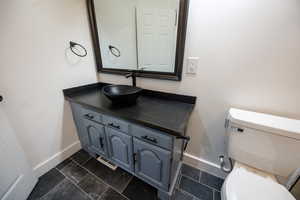 Bathroom featuring vanity and toilet