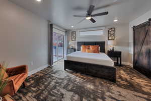 Bedroom with a barn door, access to exterior, carpet flooring, recessed lighting, and a ceiling fan