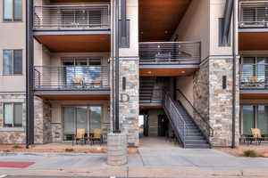 View of apartment building / complex featuring stairs