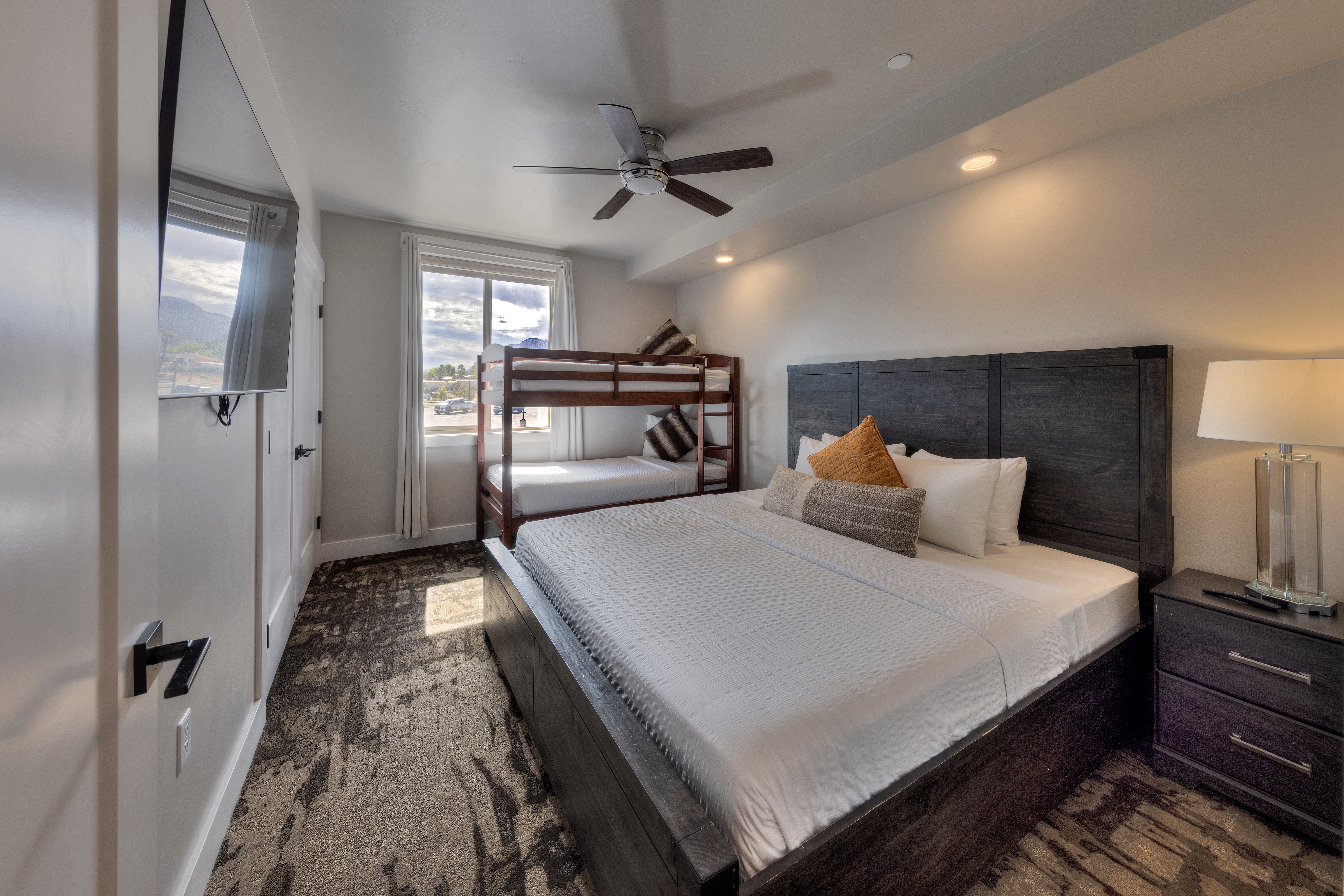 Bedroom with a ceiling fan, recessed lighting, and dark colored carpet