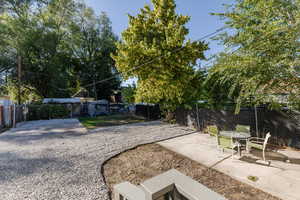 Fenced backyard with a patio area