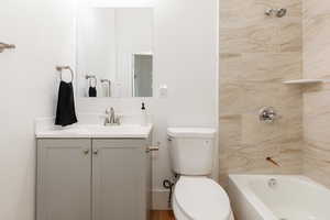 Full bathroom featuring shower / bath combination and vanity