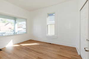 Empty room featuring light wood-style flooring