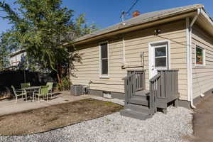 Back of house featuring a patio area and a chimney
