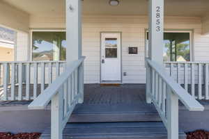 Property entrance featuring covered porch