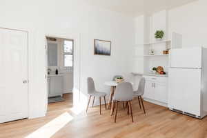 Dining space featuring light wood-style floors