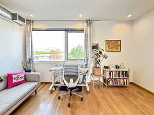 Office area with recessed lighting, light wood-type flooring, and a mountain view