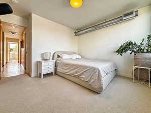 Bedroom with carpet floors and baseboards
