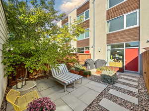 Fenced backyard with a patio area and grilling area
