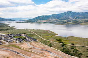 Aerial perspective of suburban area with a water and mountain view